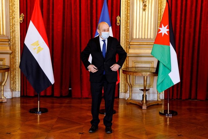 French European and Foreign Affairs Minister Jean-Yves Le Drian prepares for a picture prior to a meeting with his German, Jordan and Egypt counterparts in Paris, France March 11, 2021. (Reuters)