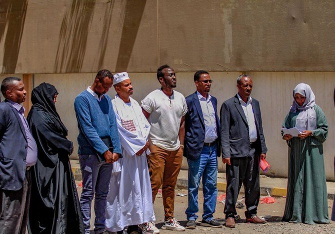 Members representing African communities in Yemen gather to speak in front of the offices of the International Organisation for Migration in the capital Sanaa, following last weekend's fire in a holding facility, on March 13, 2021. (AFP)