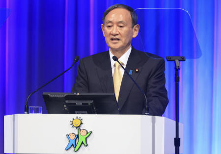 Japanese Prime Minister and ruling Liberal Democratic Party (LDP) leader Yoshihide Suga delivers a speech at the annual party convention amid outbreak of the new coronavirus in Tokyo, Sunday. (AP)