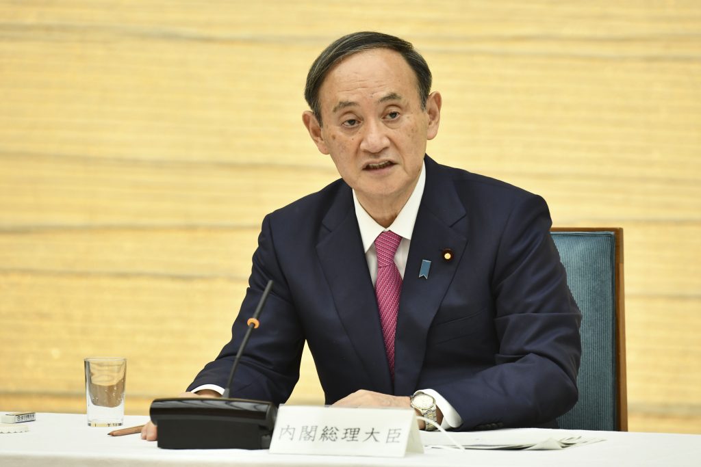 Japanese Prime Minister Yoshihide Suga speaks before reporters at his official residence in Tokyo on Wednesday, March 4, 2021. (AP)