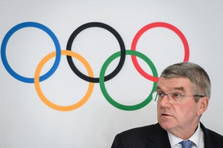 International Olympic Committee President Thomas Bach reacts after his re-election during the 137th IOC Session and virtual meeting in Lausanne, Switzerland, March 10, 2021. (AFP)