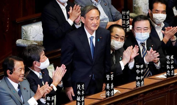Japan’s newly-elected Prime Minister Yoshihide Suga is applauded in the Lower House of Parliament in Tokyo, Japan, September 16, 2020. (Reuters)
