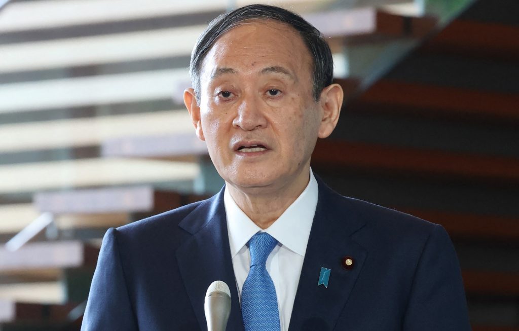 Japanese Prime Minister Yoshihide Suga speaks to reporters at the Prime Minister's Office in Tokyo on March 25, 2021, after the South's military said North Korea launched two projectiles into the sea. (AFP)