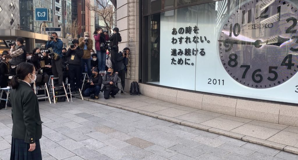 People gathered in front of the Wako department store in Ginza district central Tokyo, observing a moment of silence in front of the store’s famous clock, March. 11, 2021. (ANJP Photo)