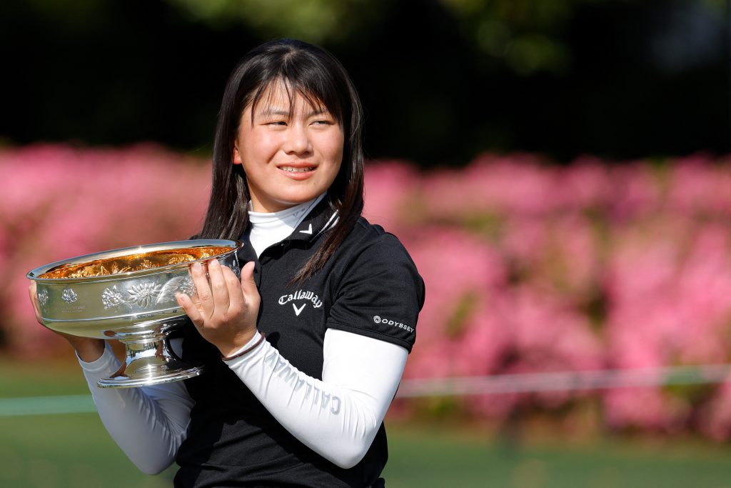 Tsubasa Kajitani of Japan celebrates with the winner's cup after the final round of the Augusta National Women's Amateur at Augusta National Golf Club on April 3, 2021 in Augusta, Georgia. (AFP)