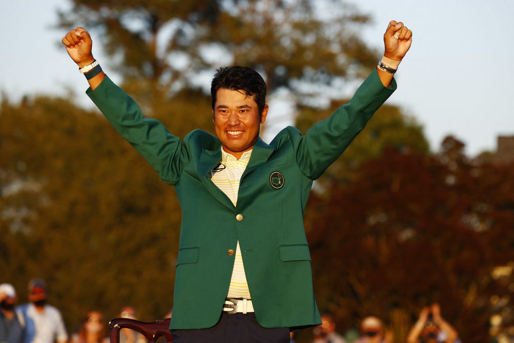 Hideki Matsuyama of Japan celebrates on the 18th green after winning the Masters at Augusta National Golf Club on April 11, 2021 in Augusta, Georgia. (AFP)