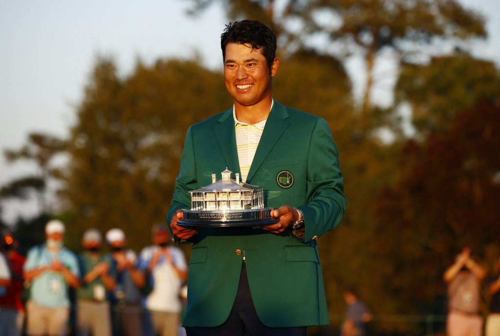 Hideki Matsuyama of Japan celebrates on the 18th green after winning the Masters at Augusta National Golf Club on April 11, 2021 in Augusta, Georgia. (AFP)