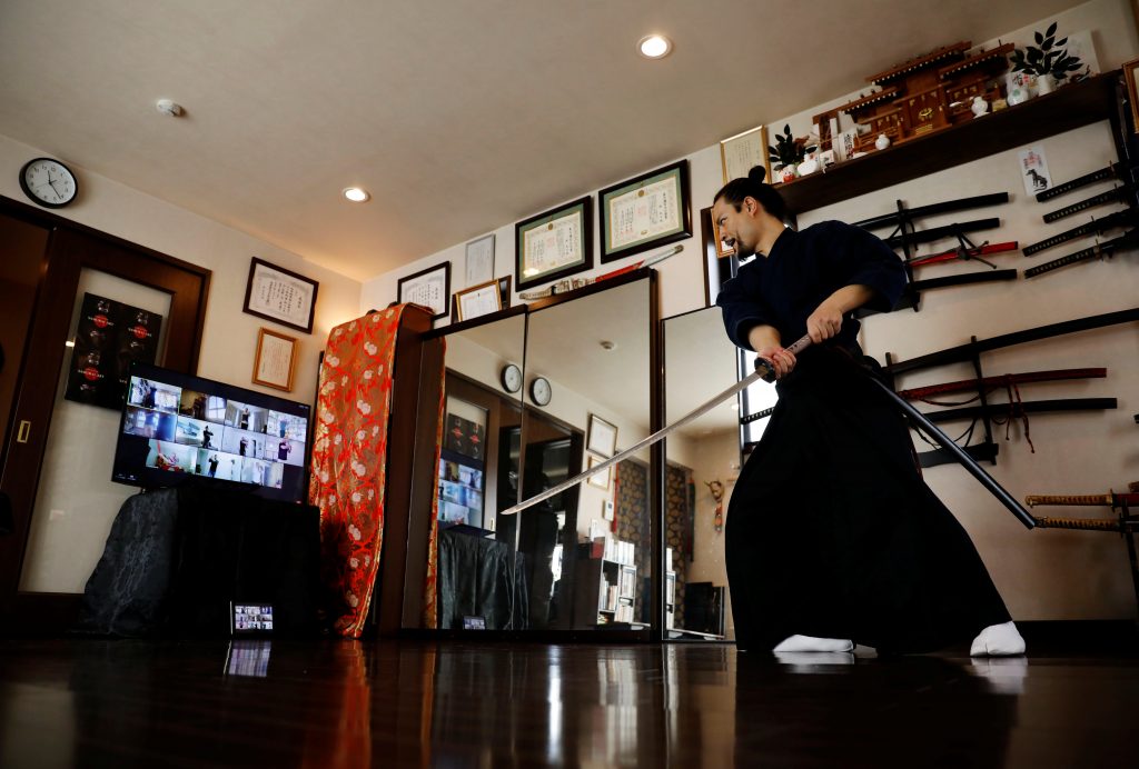 The founder of Bugaku and Samurai martial arts instructor Koshiro Minamoto during an online class for Samurai experience in Tokyo, Japan, April 1, 2021. (Reuters)