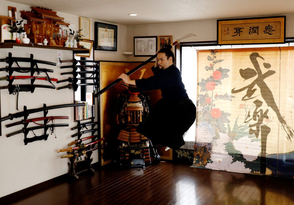 The founder of Bugaku and Samurai martial arts instructor Koshiro Minamoto during an online class for Samurai experience in Tokyo, Japan, April 1, 2021. (Reuters)