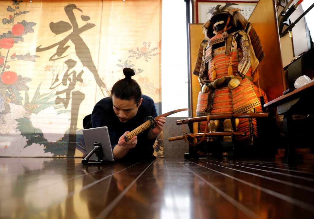 The founder of Bugaku and Samurai martial arts instructor Koshiro Minamoto during an online class for Samurai experience in Tokyo, Japan, April 1, 2021. (Reuters)