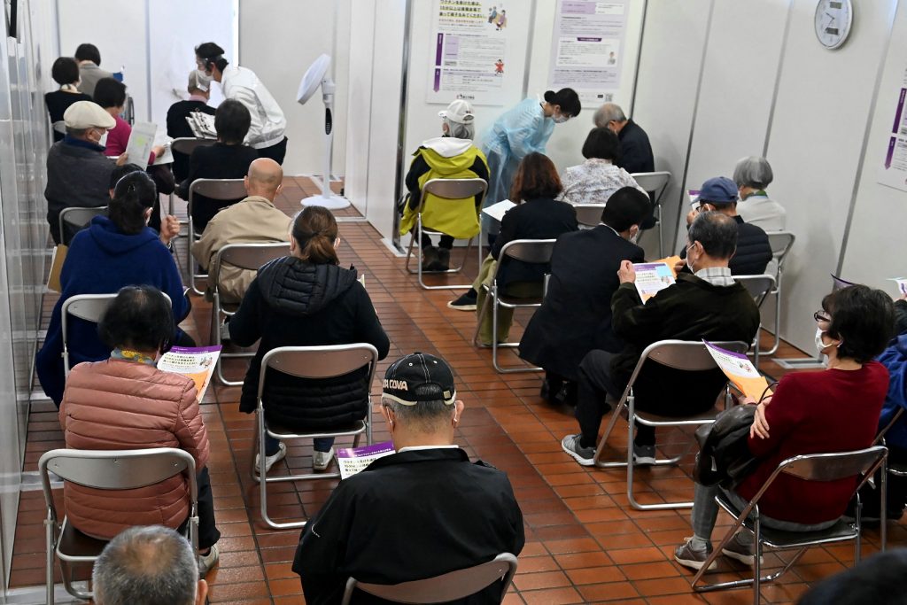 Elderly people after receiving a dose of the COVID-19 vaccine in Hachioji, Tokyo prefecture on April 12, 2021 as Japan begins vaccinating the elderly.  (AFP via JIJI Press)