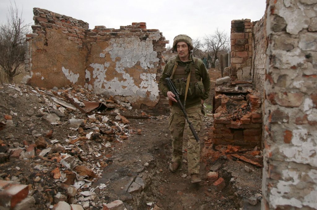 A Ukrainian serviceman patrols near the frontline with Russia backed separatists near small city of Marinka, Donetsk region, April. 12, 2021. (AFP)