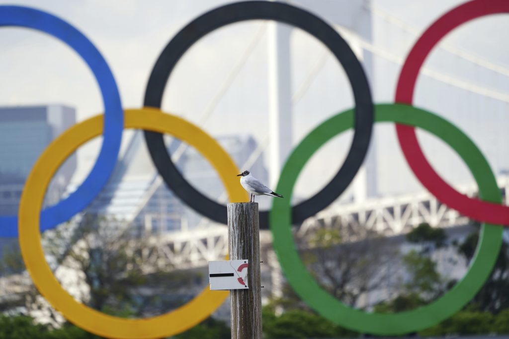 Two top officials of Japan's ruling LDP party on Thursday, April 15, 2021, said radical changes could be coming to the Tokyo Olympics. One went as far to suggest they still could be canceled, and the other that even if they proceed, it might be without any fans. (AP Photo/Eugene Hoshiko)