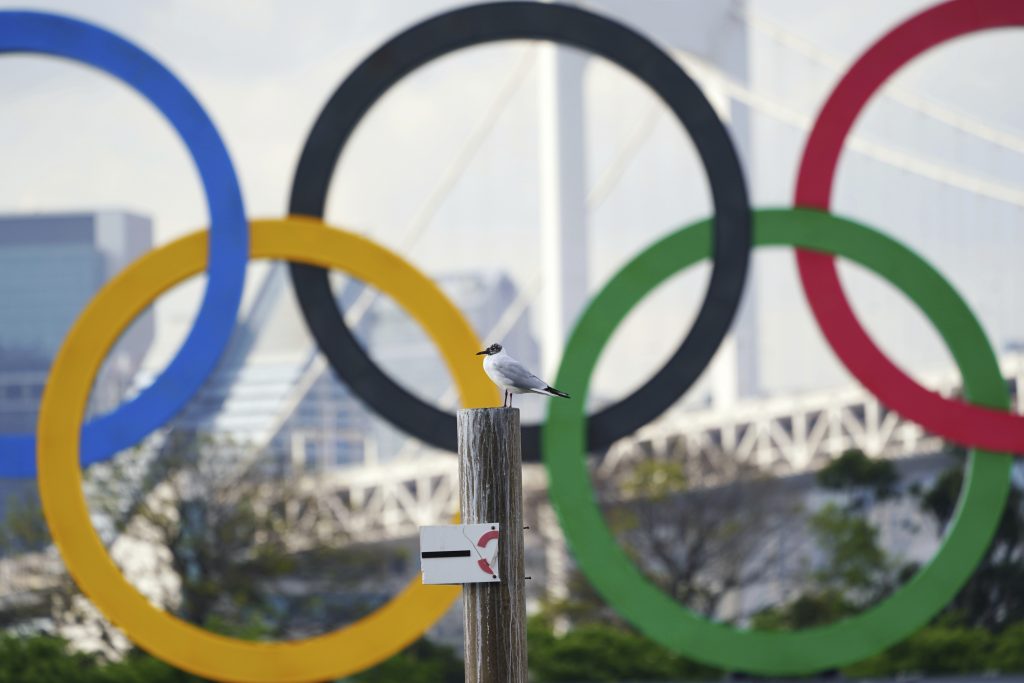 Two top officials of Japan's ruling LDP party on Thursday, April 15, 2021, said radical changes could be coming to the Tokyo Olympics. One went as far to suggest they still could be canceled, and the other that even if they proceed, it might be without any fans. (AP Photo/Eugene Hoshiko)