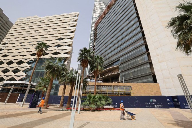 A picture taken on March 16, 2021, shows workers in the King Abdullah Financial District (KAFD) in the Saudi capital Riyadh. (File/AFP)