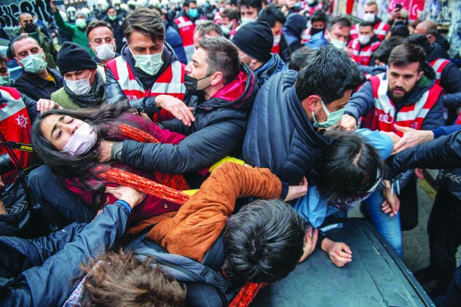 Turkish police officers beat and detain students on Thursday during a demonstration in support of Bogazici University students at Kadikoy in Istanbul. (AFP)