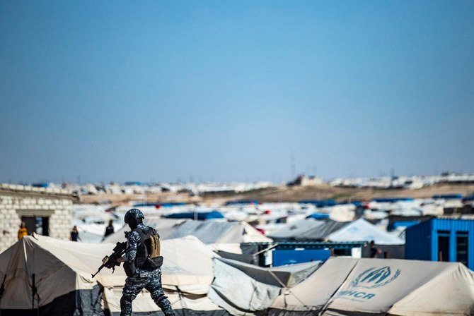 Anti-terrorist forces of the Syrian Democratic Forces keep watch on March 30, 2021 in the vicinity of Al-Hol camp. (AFP)