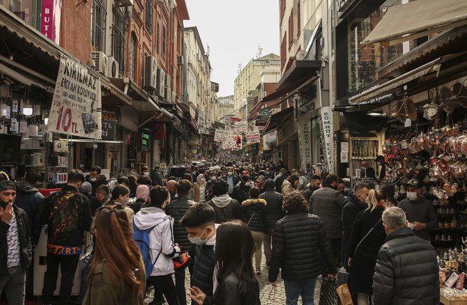 People walk in Eminonu open market in Istanbul, Friday, April 2, 2021. (AP)