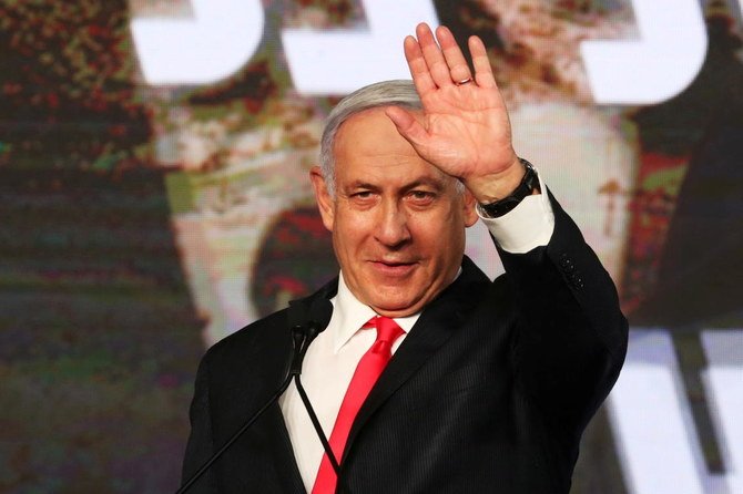 Israeli Prime Minister Benjamin Netanyahu gestures as he delivers a speech to supporters following the announcement of exit polls in Israel’s general election at his Likud party headquarters in Jerusalem March 24, 2021. (Reuters)