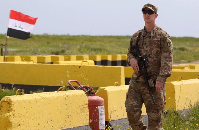 A US soldier walks at the Qayyarah air base, where US-led troops in 2017 had helped Iraqis plan out the fight against Daesh in nearby Mosul in northern Iraq, before a planned US pullout. (File/AFP)