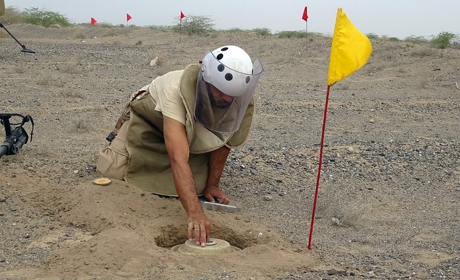 Above, a member of Yemen’s demining team searches for land mines in the western province of Hodeida on March 1, 2021. (AFP)