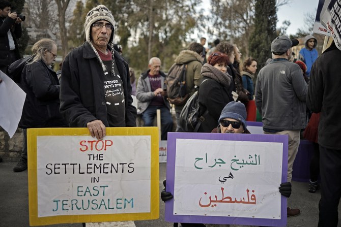 Protesters near the house of a Palestinian family, which was occupied by Israeli settlers following a court ruling, Sheikh Jarrah, Jerusalem, Jan. 18, 2019. (AFP)