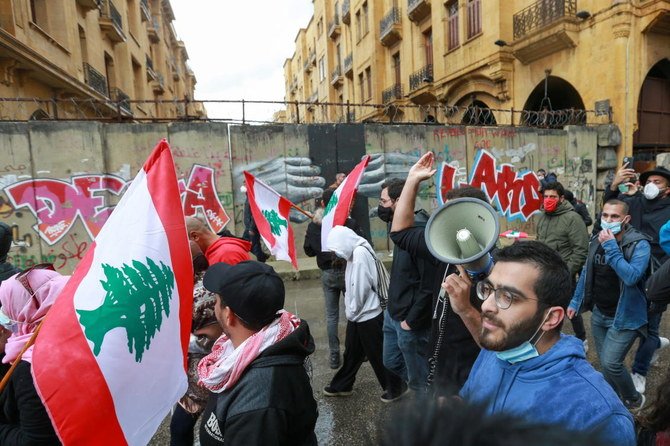 Demonstrators gather during a protest over the deteriorating economic situation, in Beirut, Lebanon April 10, 2021. (Reuters)