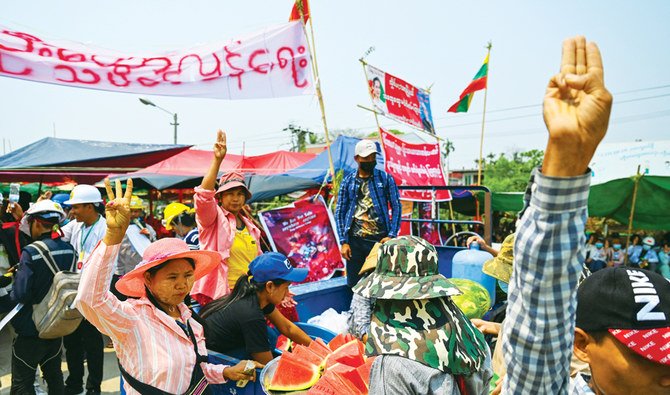 Protesters gather in Yangon, main, as security forces continue to crack down on demonstrations against the coup. (AFP)