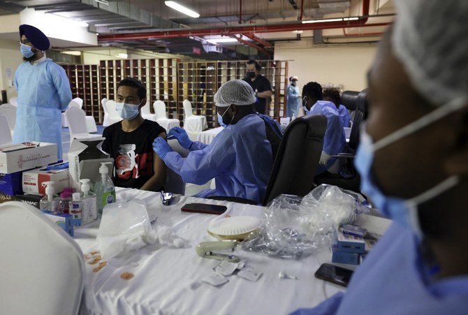The UAE’s nationwide inoculation program aims to give the population immunity from coronavirus that will help curb its spread as well as bring down infection cases. (AFP)