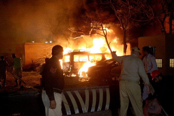 A police officer and rescue workers arrive at the site of bomb blast in Quetta, Pakistan, Wednesday, April 21, 2021. (AP)