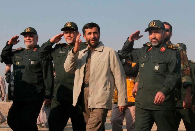 In this Nov. 26, 2006 photo, General Mohammad Hosseinzadeh Hejazi (right) accompanies then Iranian President Mahmoud Ahmadinejad (3rd left) during a ceremony in Tehran. (AP Photo/Vahid Salemi, File)