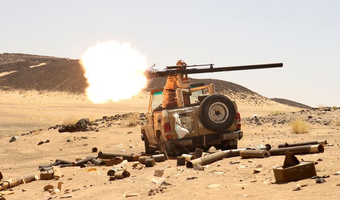 A Yemeni government fighter fires a vehicle-mounted weapon at a frontline position during fighting against Houthi fighters in Marib, Yemen March 9, 2021. (REUTERS)