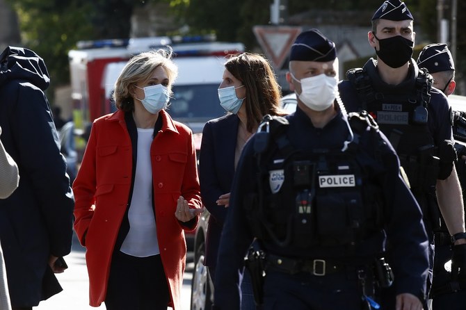Head of the Ile de France regional council Valerie Pecresse, left, arrives at the Police station in Rambouillet, south west of Paris, Friday, April 23, 2021.(AP Photo/Michel Euler)