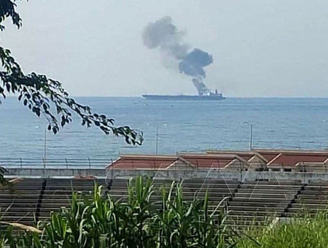 A handout picture released by the official Syrian Arab News Agency (SANA) on April 24, 2021, shows smoke billowing from a tanker off the coast of the western Syrian city of Baniyas. (AFP)