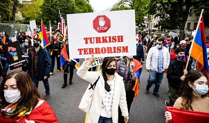 Armenians march from the Turkish ambassador’s residence to the Turkish Embassy on the anniversary of the Armenian Genocide during a protest in Washington. (AFP)