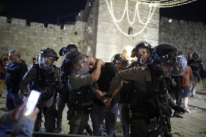 Israeli security forces detain a Palestinian protester during clashes in Jerusalem’s Old City on April 24, 2021. (File/AFP)