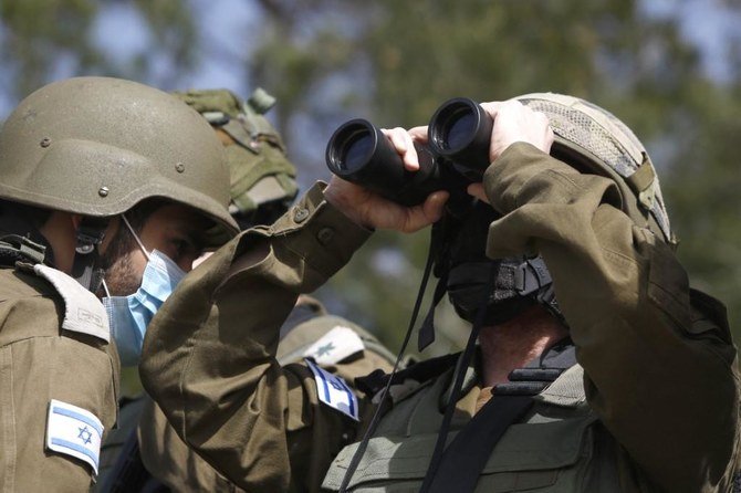 Above, Israeli forces watch the Blue Line, a demarcation line drawn by the United Nations to mark Israel’s withdrawal from southern Lebanon in 2000. (AFP file photo)