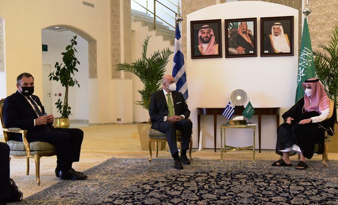 Saudi Foreign Minister Prince Faisal bin Farhan meets his Greek counterpart Nikos Dendias and Greece’s Minister of National Defense Nikolaos Panagiotopoulos. (Twitter/@npanagioto)