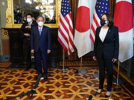 US Vice President Kamala Harris (right) hosts Japanese Prime Minister Suga ahead of a bilateral meeting in the Ceremonial Office at the Eisenhower Executive Office Building, next to the White House in Washington, DC, on April 16, 2021. (AFP)