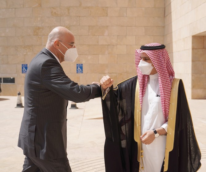 Saudi Foreign Minister Prince Faisal bin Farhan meets his Greek counterpart Nikos Dendias and Greece’s Minister of National Defense Nikolaos Panagiotopoulos. (Twitter/@GreeceMFA)