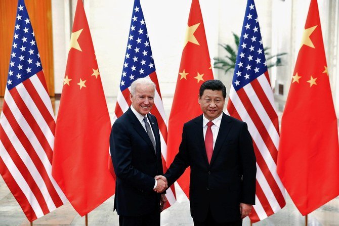 Chinese President Xi Jinping with then-U.S. Vice President Joe Biden inside the Great Hall of the People in Beijing, December 2013. (Reuters)