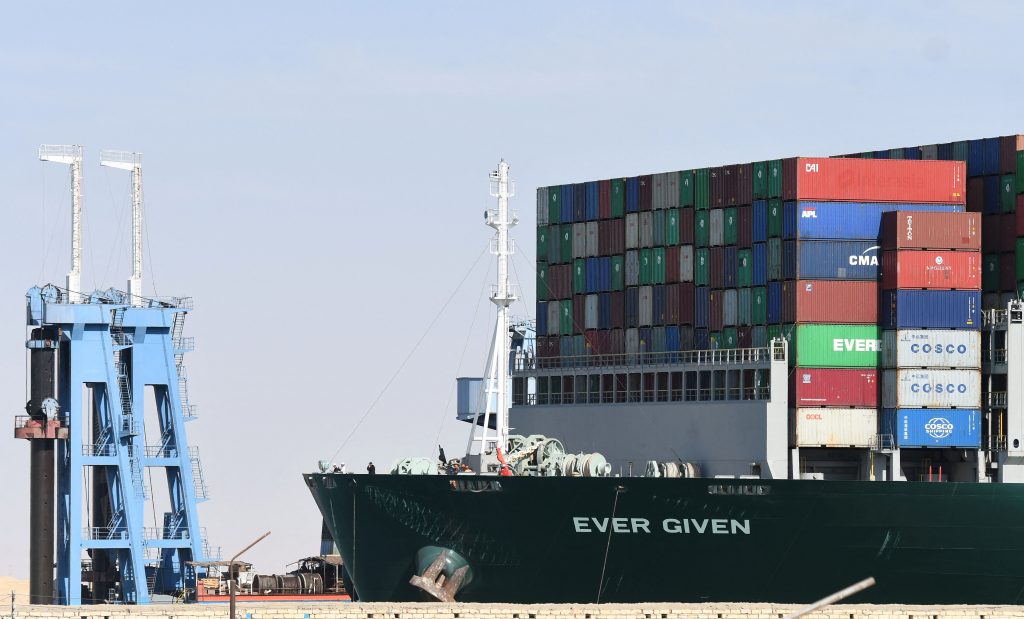 The Panama-flagged MV 'Ever Given' container ship is tugged in Egypt's Suez Canal after it was fully dislodged from the banks, near Suez city, March. 29, 2021. (AFP)