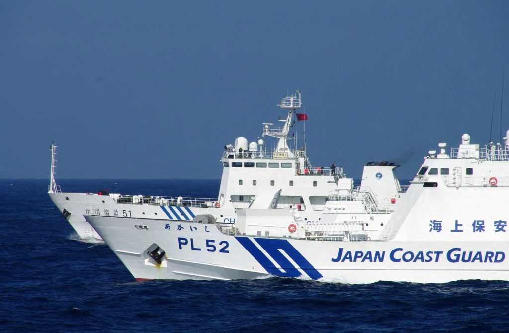 The ships approached Japanese fishing boats while staying in the waters. (AFP)