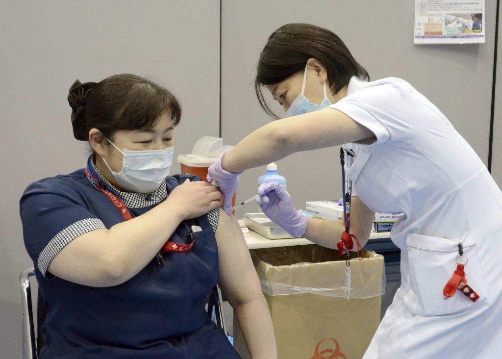 Some nurses in Japan are incensed at a request from Tokyo Olympic organizers to have 500 of them dispatched to help out with the games, saying that they’re already near the breaking point dealing with the coronavirus pandemic. (File photo/Kyodo News via AP)