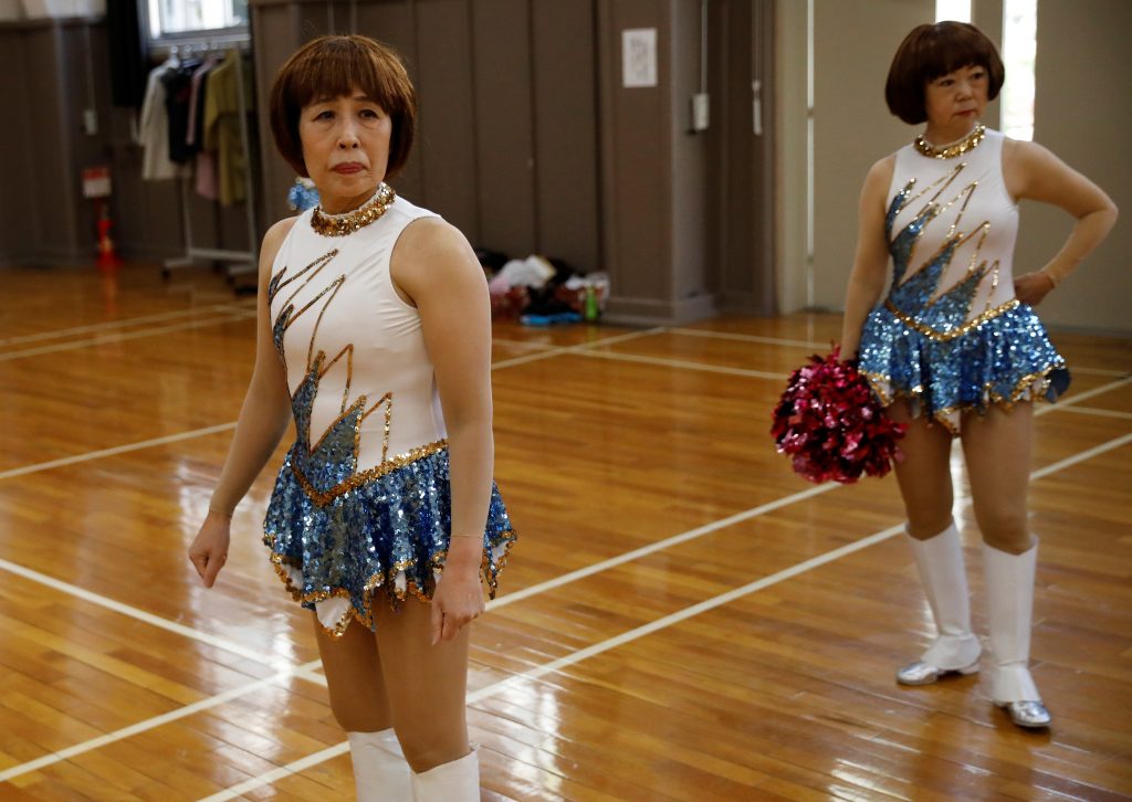 Tami Shimada, 69, a member of a senior cheer squad called Japan Pom Pom, prepares to film a dance routine for an online performance in Tokyo, Japan, April 12, 2021. (Reuters)