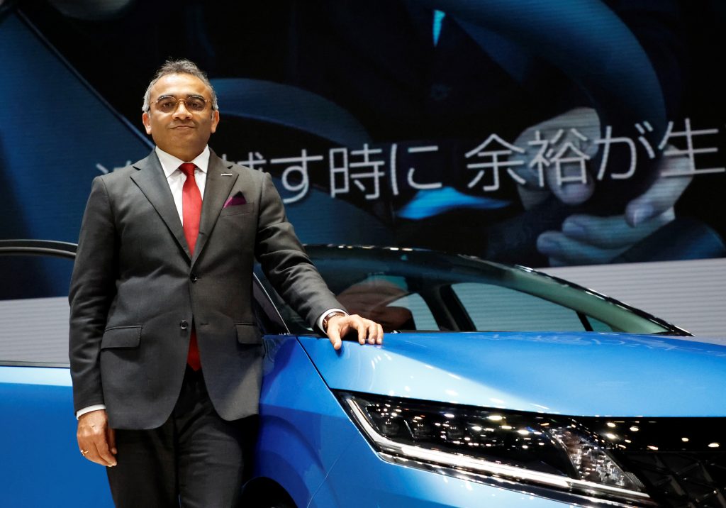 Nissan COO Ashwani Gupta poses with compact car Note equipped with Nissan's e-Power hybrid technology, after an interview with Reuters at its showroom in Yokohama. (File photo/Reuters)
