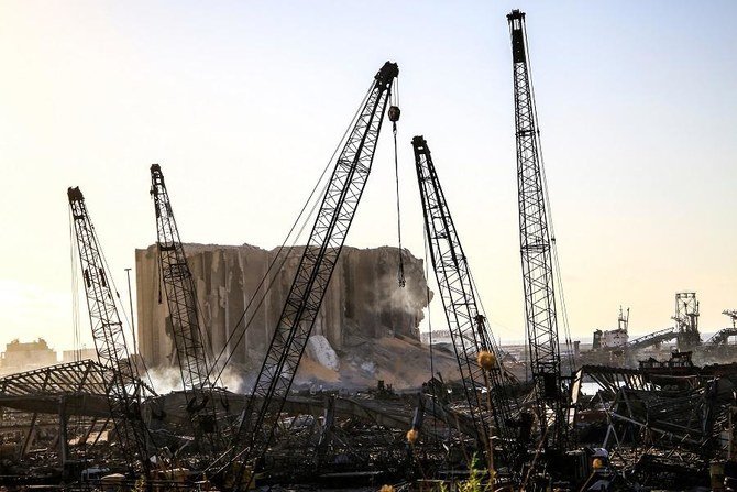 Cranes and wrecked silos building of Beirut Port. On Friday, a ship prepared to ferry 59 containers of hazardous materials to Germany, months after disaster struck on the dockside. (AFP)