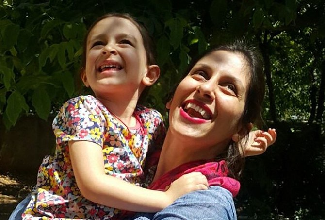 In this file photo taken on August 23, 2018 shows Nazanin Zaghari-Ratcliffe (R) embracing her daughter Gabriella in Damavand, Iran following her release from prison for three days. (File/AFP)