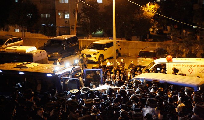Mourners gather for the funeral of Eliyahu Cohen, who died during Lag BaOmer celebrations at Mt. Meron in northern Israel, in Jerusalem on Saturday, May 1 2021. (AP)