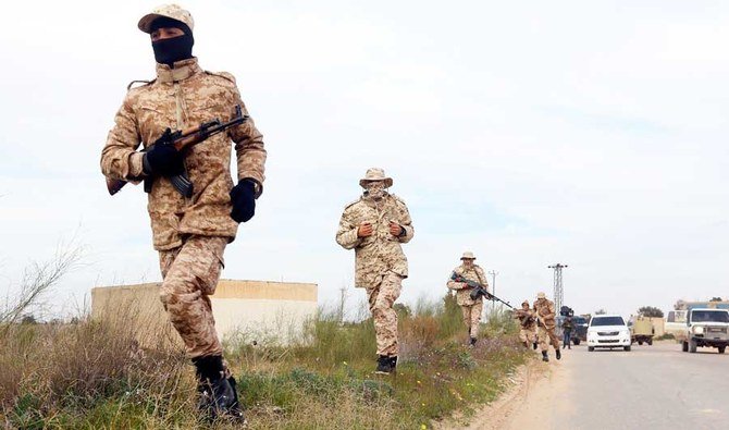 Members of the Tripoli Protection Force, an alliance of militias from the capital city, patrol an area south of the Libyan capital. (AFP file photo)